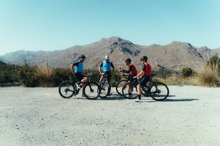 Tourists exploring Mallorca mountains with rented road bikes