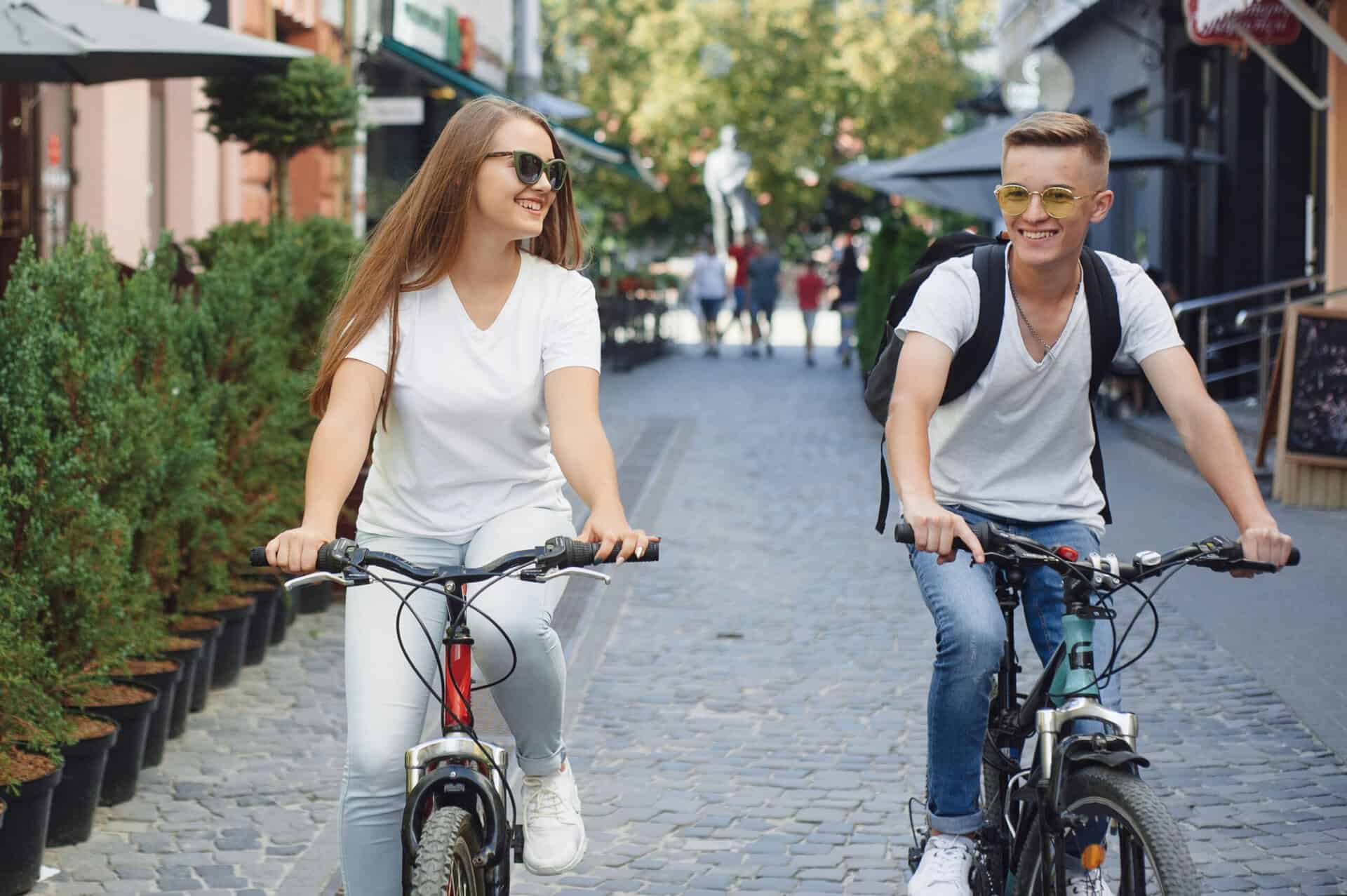 People with a bikes. Couple in a park. Morning bike ride.